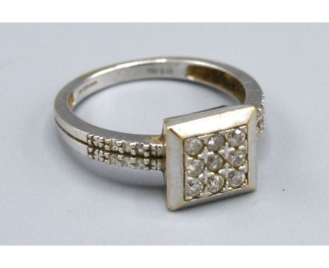 An 18ct. White Gold Square Set Diamond Ring, 3.4gms. ring size M 