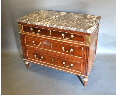 A 19th Century Mahogany French Commode, the variegated marble top above three drawers with brass handles and escutcheons, rai