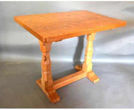 Robert (Mouseman) Thompson, A Rectangular Oak Hall Table with twin end octagonal supports and stretcher with carved model of 