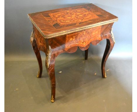 A French inlaid and gilt metal mounted card table, the hinged top above a shaped inlaid frieze, raised upon cabriole legs wit