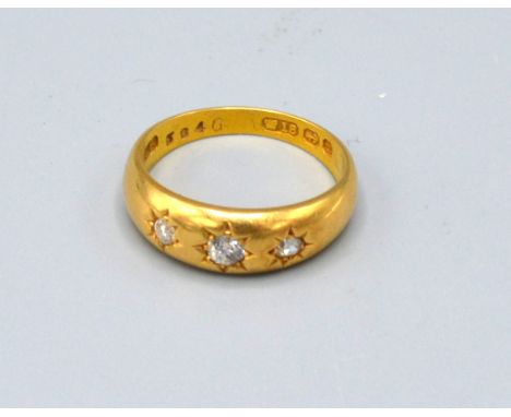 An 18ct. Gold Three Stone Diamond Ring 6.1 gms ring size P 