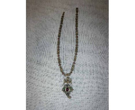 A CONTINENTAL WHITE METAL AND ENAMEL PENDANT NECKLACE set with coloured stones in purple and yellow with mother-of-pearl drop
