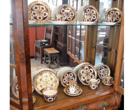 A ROYAL CROWN DERBY IMARI TEA SERVICE FOR EIGHT, with sugar bowl, milk jug and two bread and butter plates