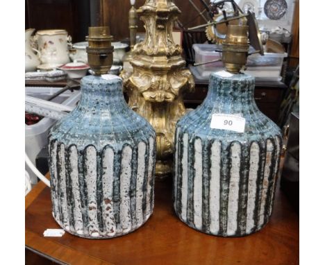 A PAIR OF ART POTTERY CYLINDRICAL TABLE LAMP BASES, with glazed and carved decoration, stamped 'DP', 9.5" high