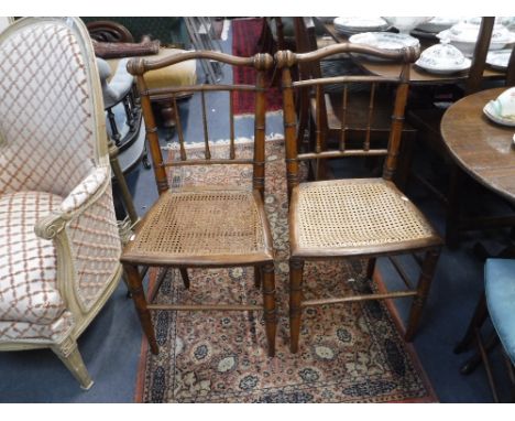 A PAIR OF EARLY VICTORIAN BEDROOM CHAIRS with ring-turned decoration and cane seats