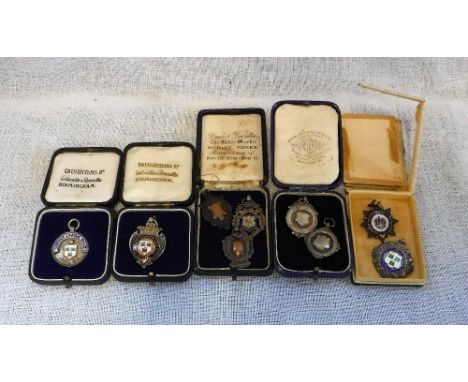 A COLLECTION OF SILVER FOBS including silver and enamel, Dorset Junior League and others, some with engraved inscriptions