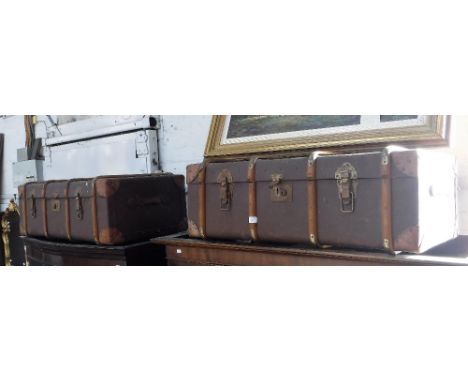 A VINTAGE WOODEN BOUND CABIN TRUCK and another similar
