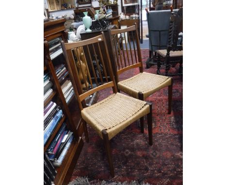 A SET OF FOUR VINTAGE MID-CENTURY DANISH TEAK CHAIRS with woven string seats, purchased by the vendor from, 'The Scandinavian