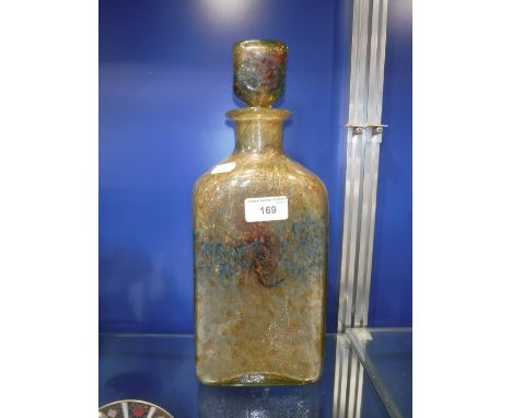 A MONCRIEFF SCOTTISH GOLD FLECKED AND COLOURED GLASS DECANTER WITH STOPPER, original paper label on base, 34cms high