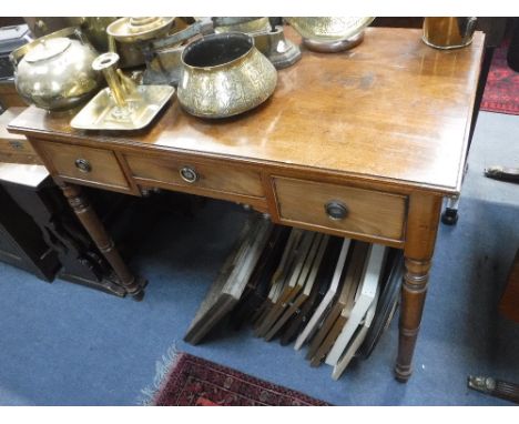 A REGENCY MAHOGANY DRESSING TABLE on ring turned legs, 36.5" wide