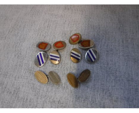 A PAIR OF SILVER AND ENAMEL CUFFLINKS, a pair of silver gilt and engine-turned cufflinks and a pair of base metal cufflinks (