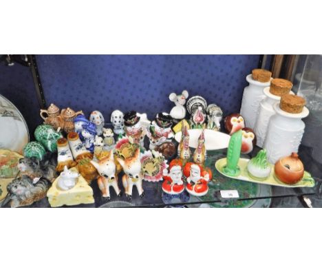 A COLLECTION OF VINTAGE CERAMIC CRUETS including novelty examples and three Portmeirion 'Totem' storage jars