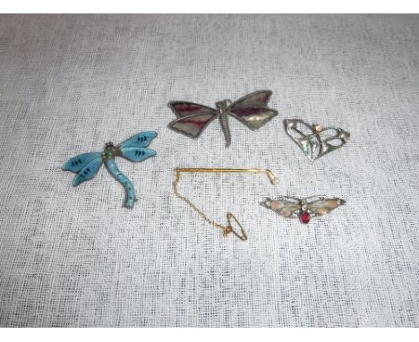 A SILVER BROOCH by Charles Horner, a silver and enamel dragonfly brooch, two other dragonfly and butterfly brooches and a yel