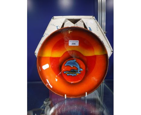 A POOLE POTTERY CHARGER, final edition, the Poole Dolphin, limited edition to mark the closure of the quayside factory in a c