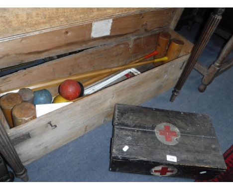 A VINTAGE SLAZENGERS CROQUET SET, in a pine box and wooden First-Aid box