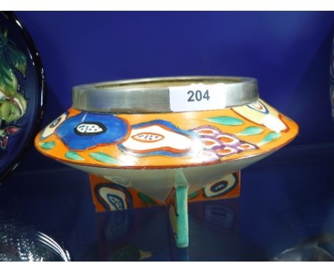 A CLARICE CLIFF BIZARRE PATTERN POTTERY BOWL with silver plated rim (A/F)