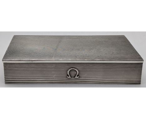 An Omega silver watch box, engine turned finish, hallmarked Birmingham, 1957, maker Atkins Bros Ltd for Omega, 262g, H.3cm L.
