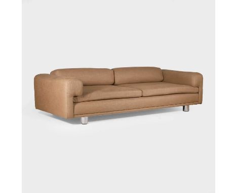 Howard Keith, a 'Diplomat' sofa, upholstered in brown fabric, with four polished aluminium cylinder feet,258cm wide108cm deep