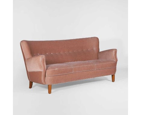 Danish, a three-seater curved settee, 20th century, upholstered in blush-pink velvet,172cm wide76cm deep77cm high, seat 41cm 