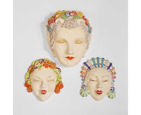 Clarice Cliff (1899-1972),  a group of three pottery wall masks, c.1930, including 'Pan', printed marks, 17.2, 17.6 and 23.5c