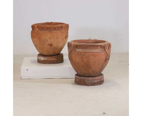 Compton Pottery, a pair of terracotta 'Floreat' garden vases, c.1900, designed by Mary Seton Watts, each incised 'WE', with b