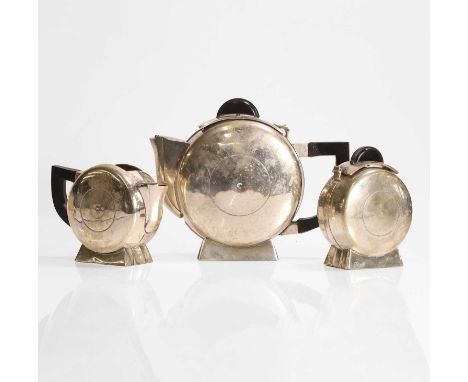 Art Deco, a French tea set, 1930s, silver-plate and Bakelite, comprising a teapot with a hinged lid, a creamer, and a sugar p