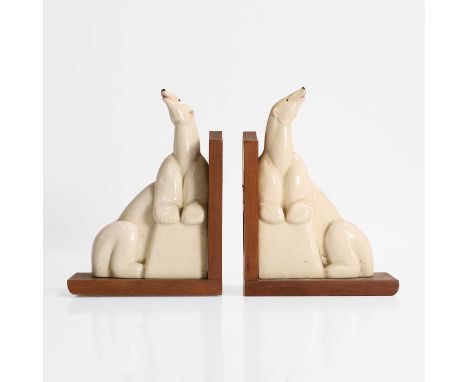 Royal Worcester, a pair of Art Deco bookends modelled as polar bears, ceramic and wood, with Royal Worcester red ink stamp wi