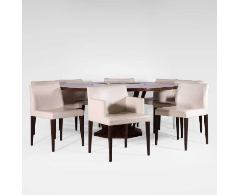 Poltrona Frau, a contemporary dining suite, comprising:a Macassar ebony circular dining table,with a glass centre, raised on 