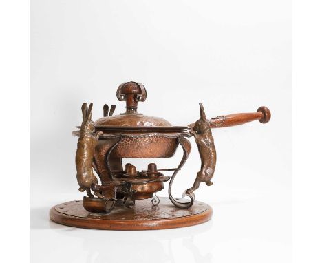 Joseph Heinrichs (German-American, 1866-1937), an unusual copper and bronze warming pan, stand and burner, c.1908, the stand 