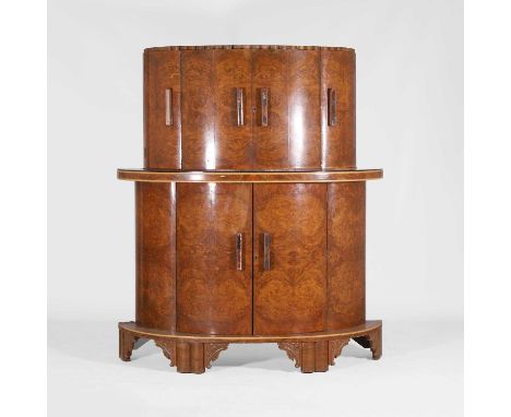 Epstein, an Art Deco Epstein walnut cocktail cabinet, c.1930, of demilune form, with a pair of central cupboards flanked by a