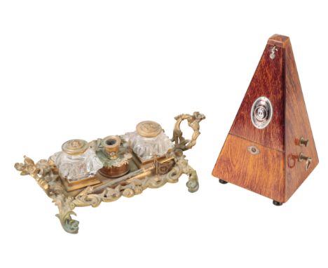 A SYSTEM MAELZEL METRONOME in oak pyramidical case, 22cm; a mantel clock and a rococo style brass and cut-glass desk inkwell 