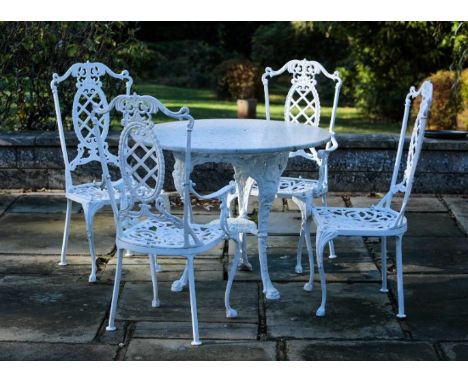 A SET OF FOUR COALBROOKDALE STYLE PAINTED CAST-IRON GARDEN CHAIRS 103cm high, together with a similar table, with a stone top