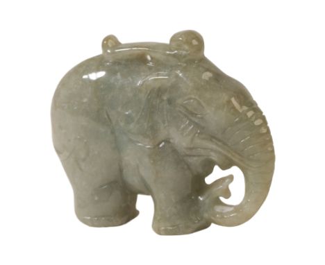 A COLLECTION OF JADE including an elephant pendant, 5.5cm; a dragon pendant in pale celadon stone, 5.5cm; and a pendant in th