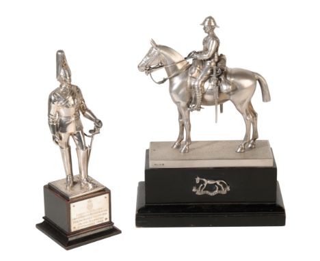 A SILVER MODEL OF AN OFFICER OF THE ROYAL HORSE GUARDS (THE BLUES) by Carrington and co., London, 1912, the officer standing 