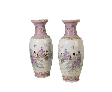 A PAIR OF CHINESE FAMILLE ROSE VASES, 20th century, the baluster sides decorated with immortals, with apocryphal red seal mar