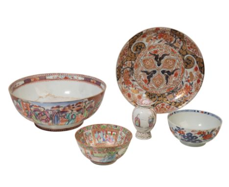 A JAPANESE IMARI DISH densely decorated in iron red, gilt and underglazed blue with flowers and foliage, the reverse with thr