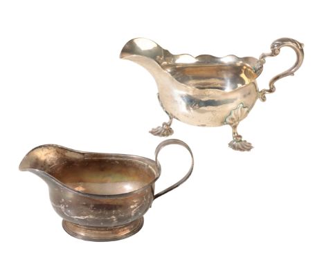 A GEORGE IV SILVER SAUCEBOAT by Robert Garrard I, London, 1816, of squat form with a reeded border and scroll handle together