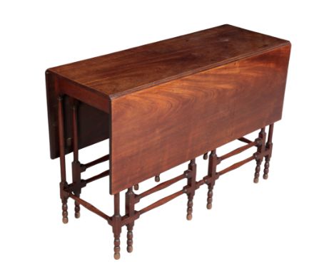 A GEORGE III MAHOGANY 'SPIDER' GATELEG TABLE second half 18th century, the rectangular drop flap top above turned column doub