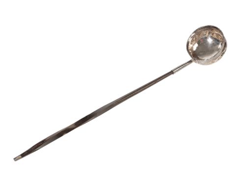 A HORN AND SILVER TODDY LADLE 19th century, the circular bowl mounted on a formed, twisted horn handle, 32.5cm long , togethe