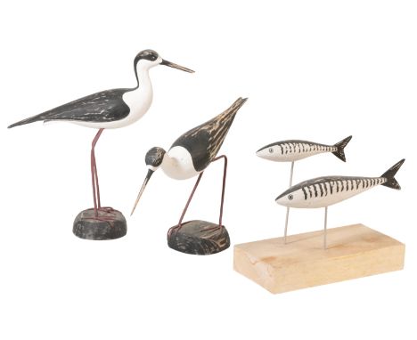 MANNER OF GUY TAPLIN: A CARVED WOODEN MODEL OF A WADING BIRD, 58cm; another; and two mackerel on a stand (3)From The Estate o