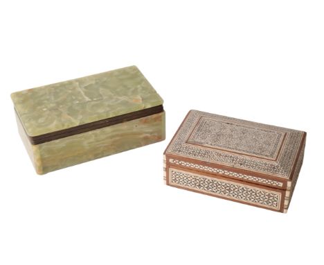 AN ART DECO STYLE ONYX CIGARETTE BOX AND COVER of rectangular form, 16cm; and another box and cover (2)From The Estate of Joh