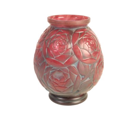 PIERRE D'AVESN: A FRENCH ART DECO MOULDED RED GLASS VASE of ovoid form, moulded with stylised flowers in low relief overall, 