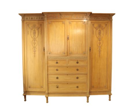 AN EDWARDIAN BLEACHED MAHOGANY WARDROBE IN GEORGE III STYLE 225cm high x 240cm wide x 66cm deepFrom The Estate of John Whitwe