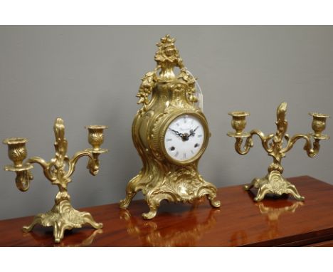 Italian cartouche shaped gilt metal clock garniture, white enamel dial signed 'Imperial', twin train 'Franz Hermle' movement 