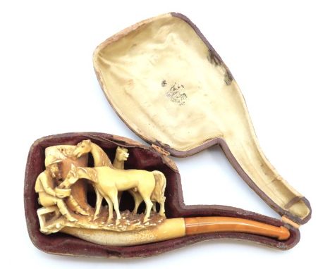 A 19thC. carved meerschaum pipe featuring horse & figure group, fault to case clasp, case 154mm wide