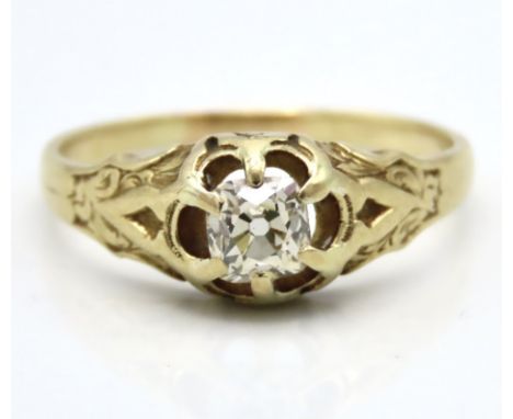 An 18ct gold ring with carved decor set with old cut diamond of approx. 0.5ct, 3.9g, size Q/R