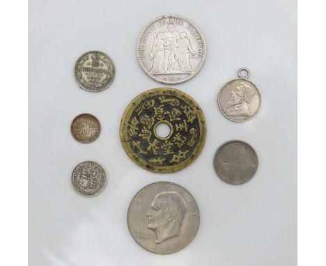 A bronze Chinese "Eight Treasures" numismatic coin charm, a 1974 US dollar, a Victorian 1887 silver sixpence, a French silver