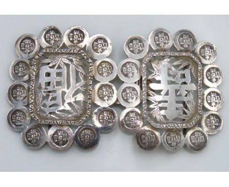 A Chinese silver buckle marked 90, 105mm wide x 60mm high, 41.6g