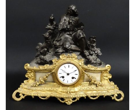 A 19thC. French gilt mantle clock featuring bronze sculpture of La Fontaine with The Crow & The Fox, with key & pendulum, 450
