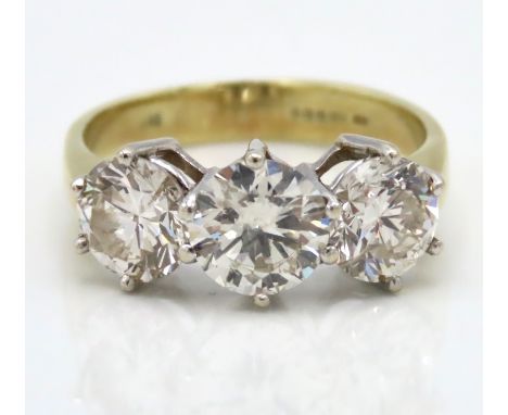 An 18ct gold diamond trilogy ring, centre stone approx. 1.19ct, the other stones approx. 1.01ct each, total approx. 3.21ct, c